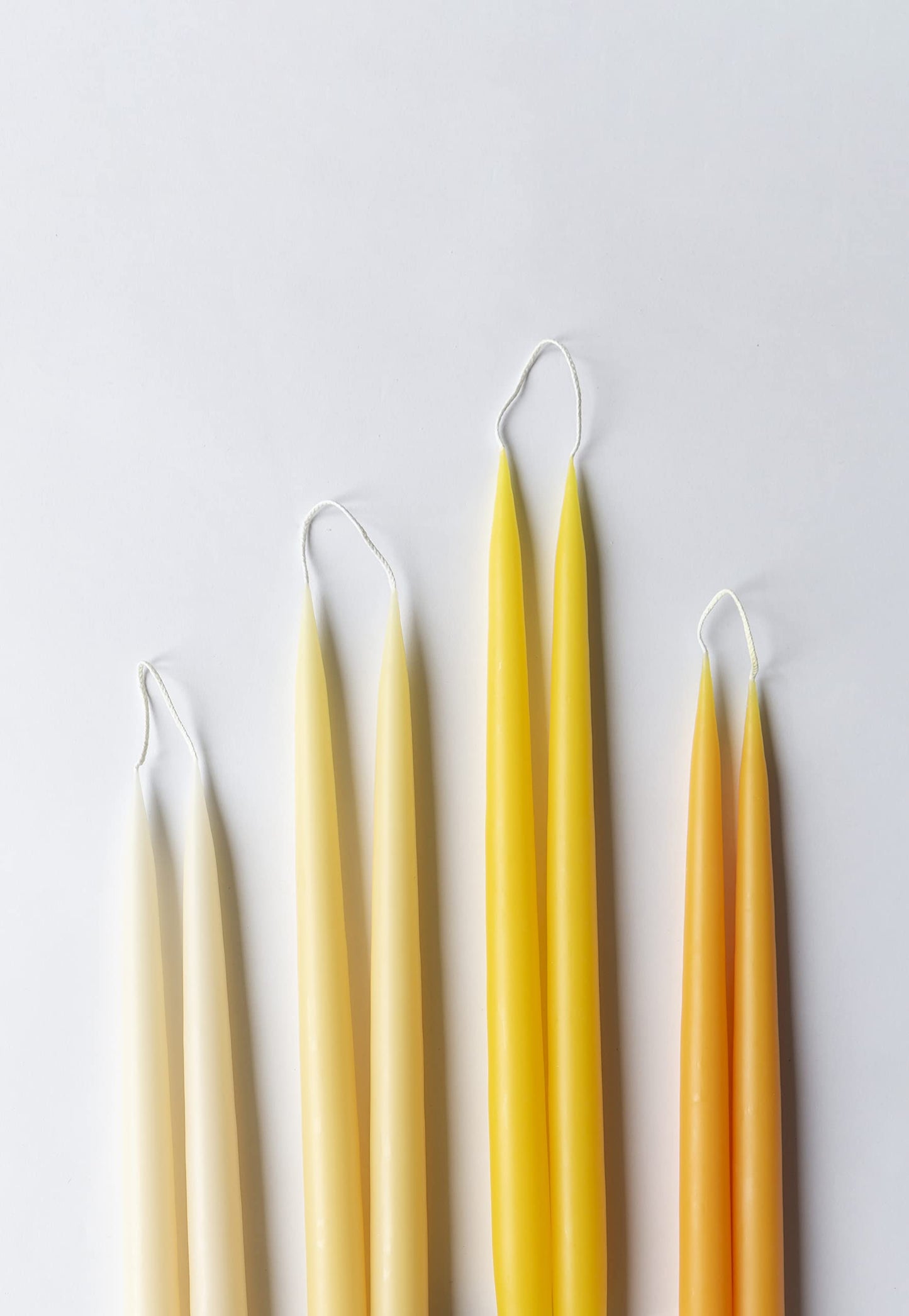 Kunstindustrien® Taper Candles – Set of 4, 13.8" – Made in Denmark, Long Burning Candles 15h, Unscented & Smokeless Candlesticks – Elegant Tall Candles for Weddings Dinners & Home Decor (Lemon Yellow)